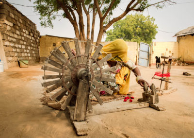 Women using spinning wheel